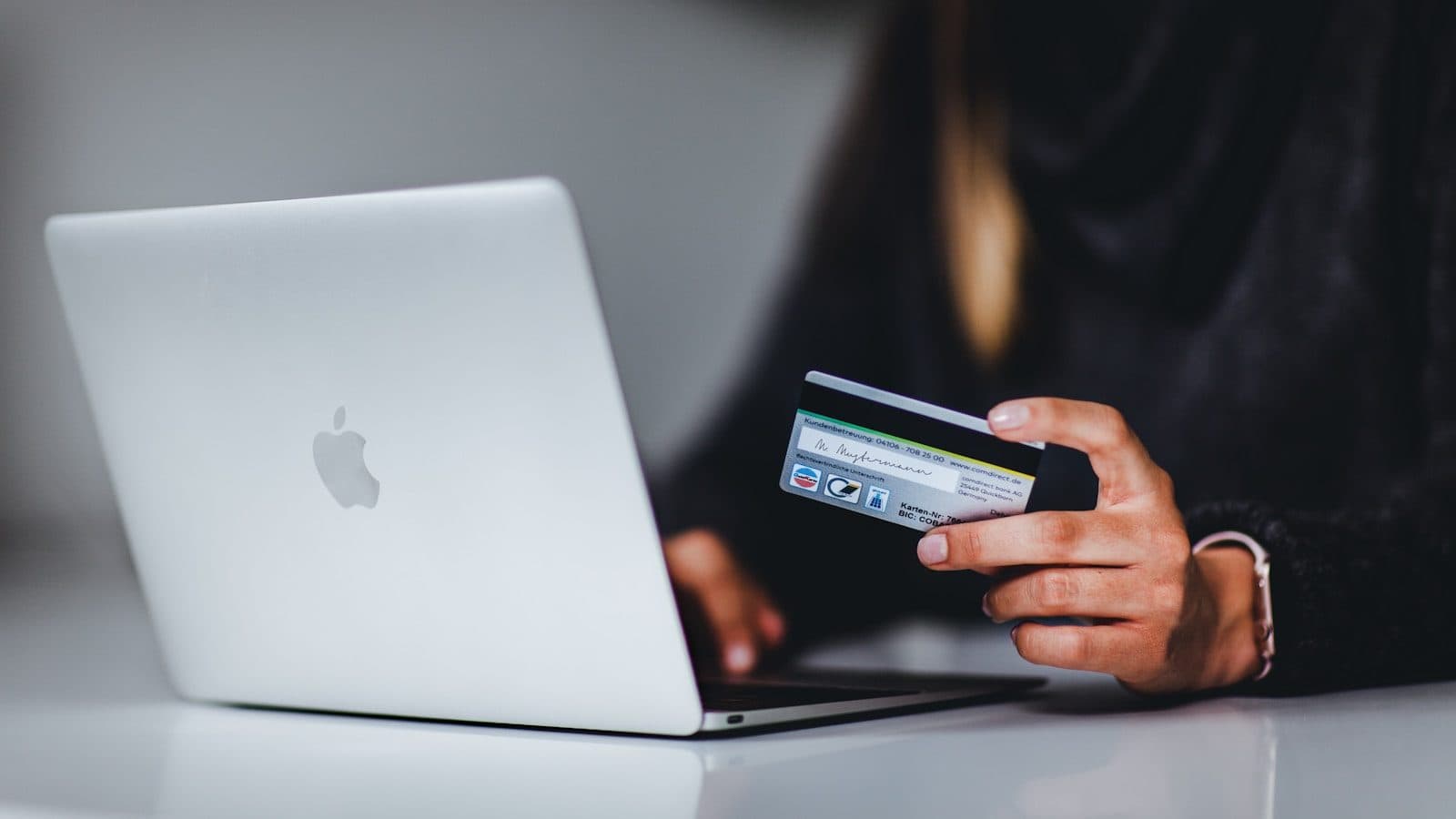 Payment details entered on a laptop — pricing conversations go better when both sides talk about three-year cost, not just the build invoice