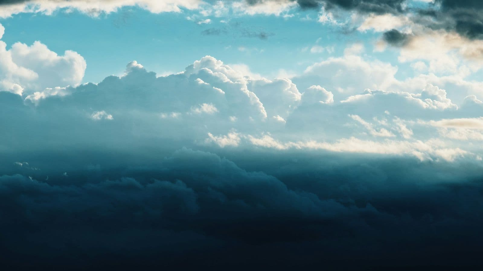 A thick bank of white clouds lit by sunlight under a darkening blue sky. The name is borrowed from the sky, but everything the cloud does happens on very real machines on the ground