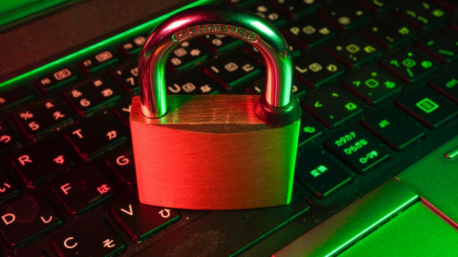 A padlock resting on a keyboard — most WordPress compromises come through outdated plugins, and they take your search rankings with them