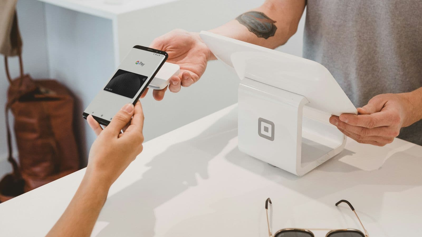 A merchant counter contactless payment — the moment your architecture either holds or quietly loses somebody's money
