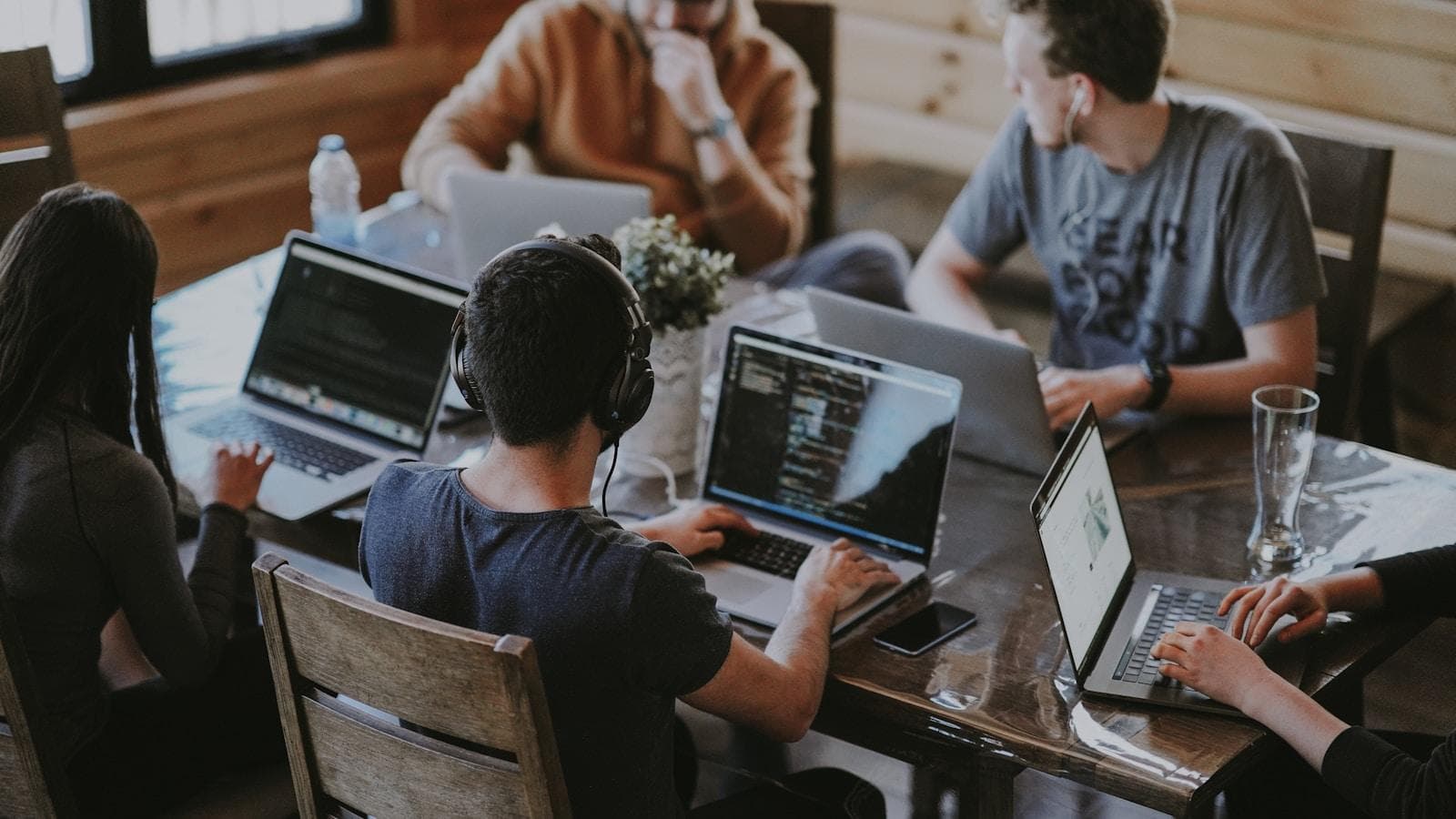 A company's real product is redundancy — the outcome continuing regardless of which individual is available on any given week