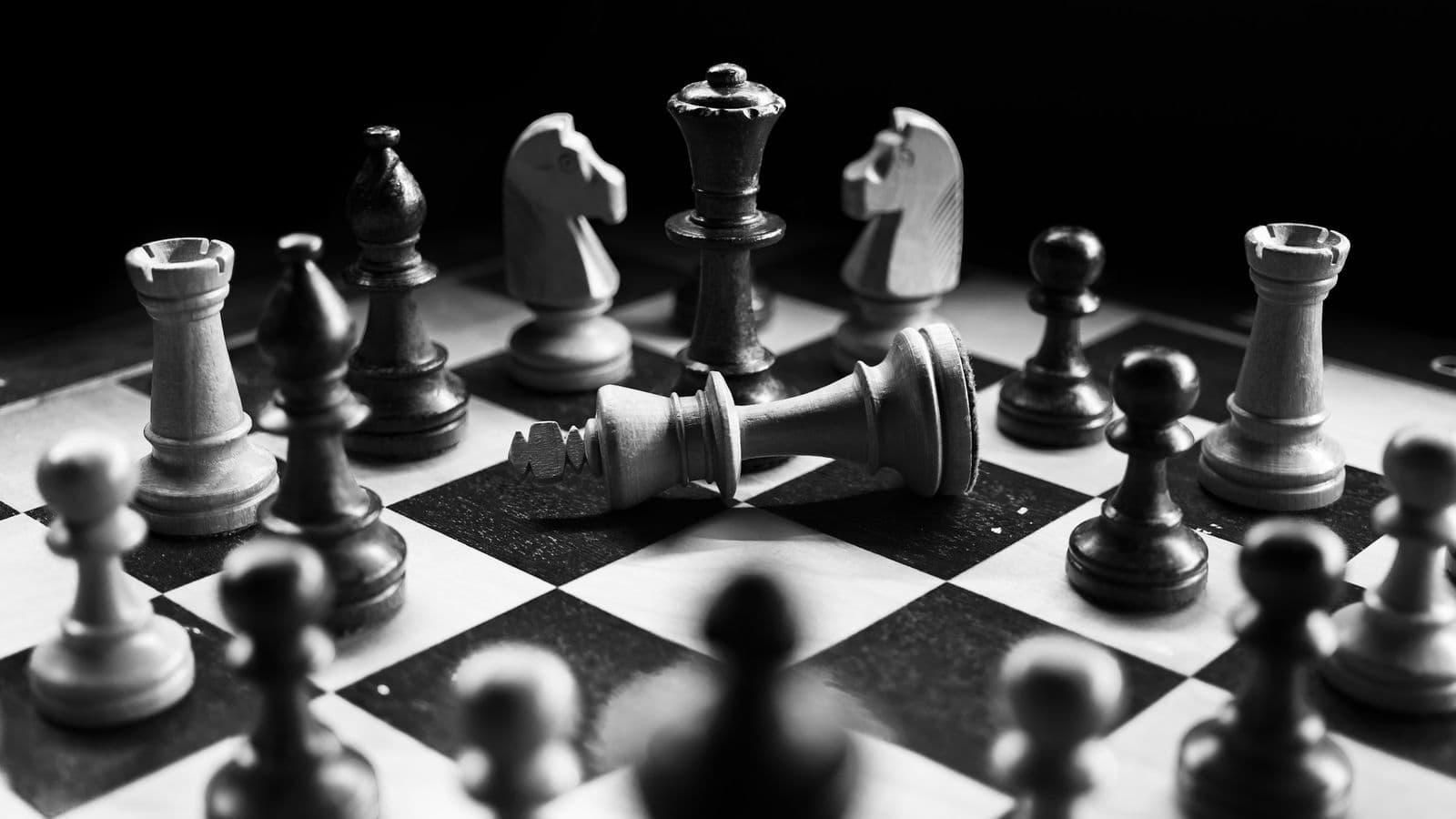 A black-and-white chessboard with one king toppled. Jev is built for the quick judgement calls in a workflow, not for long chains of reasoning