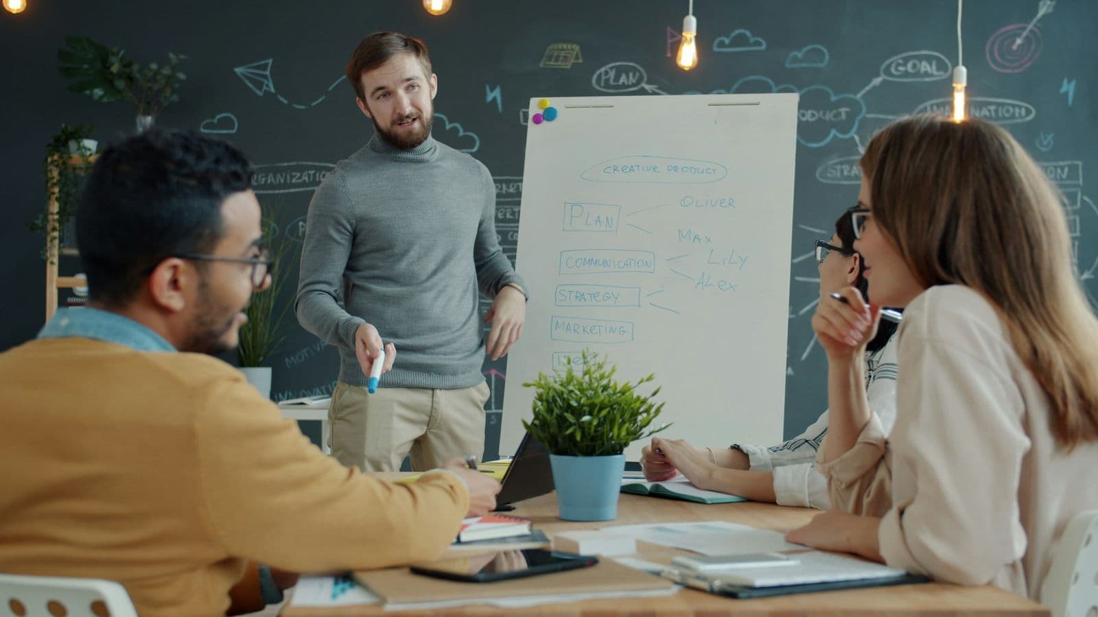 A team gathered around a whiteboard in a planning session. The value comes from deciding which calls should be decisions, not from swapping models