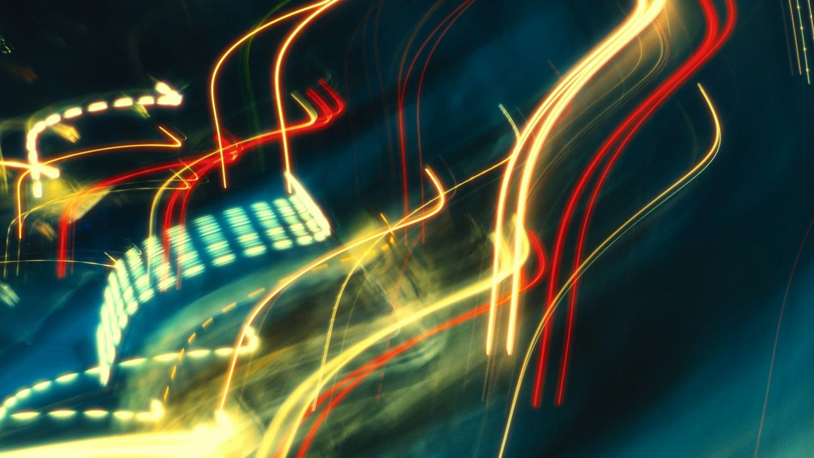 Long-exposure light trails streaking through a dark frame. Jev's speed comes from answering every question in one parallel pass rather than writing tokens in sequence