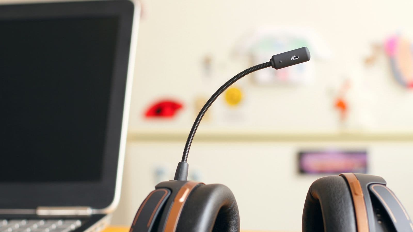 An empty headset resting beside an open laptop. Ticket triage and routing is the kind of high-volume, bounded decision Jev was built for