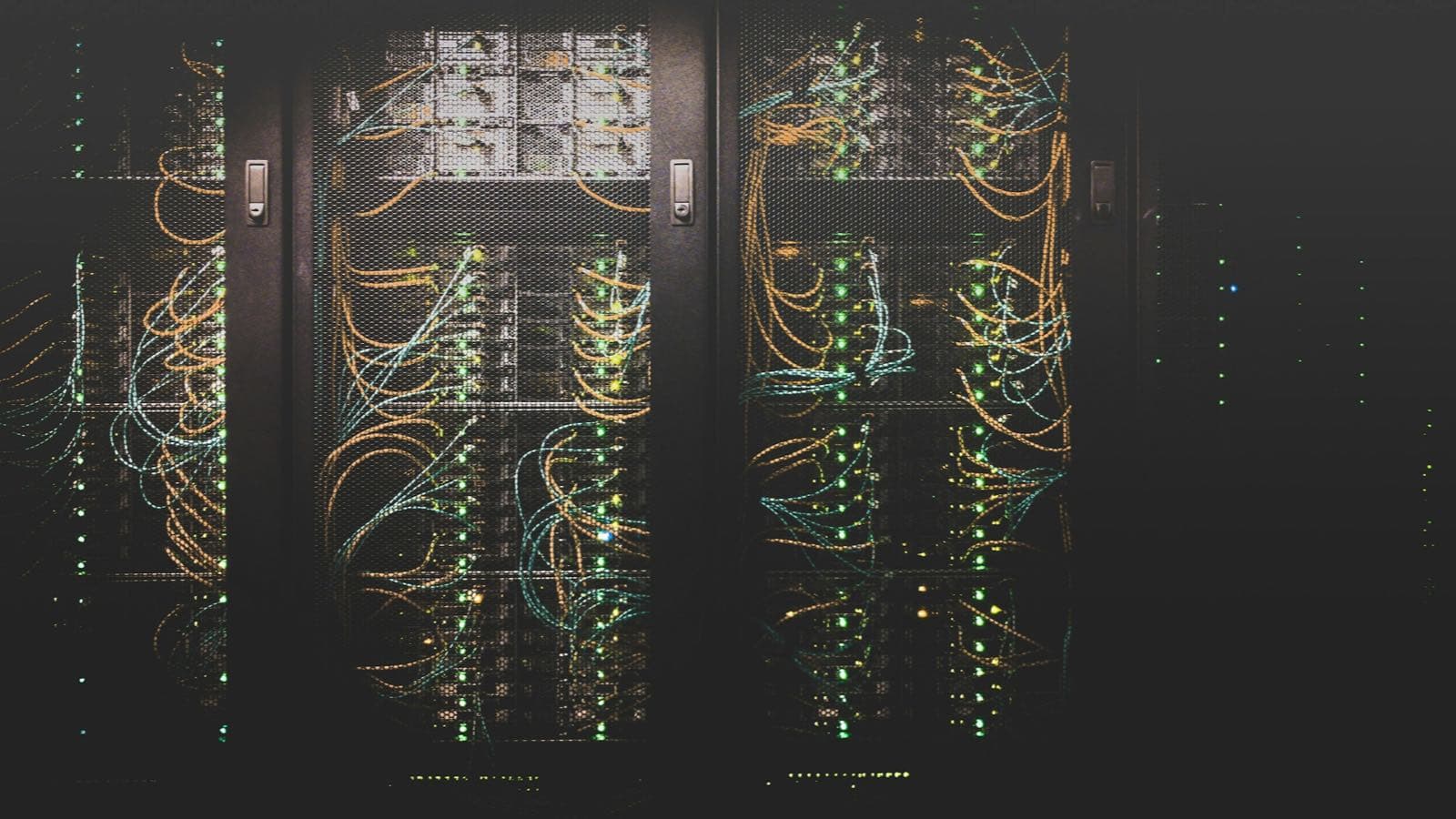 Network cabling glowing in a dark rack — caching is where a Next.js app's speed and its correctness are traded against each other, so the trade should be written down