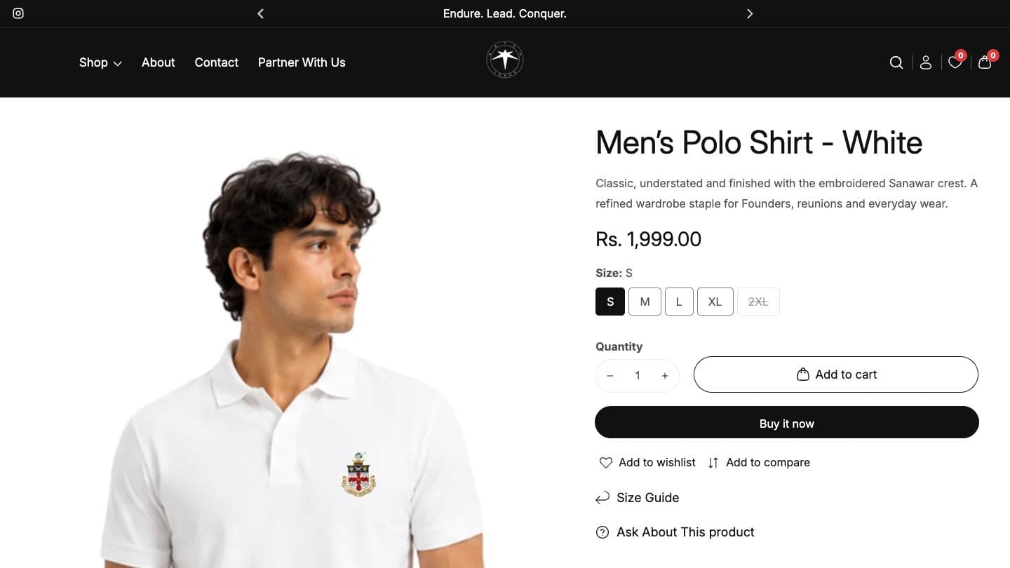 Batch Of Legends product page for a men's white polo with the embroidered Sanawar crest, showing price, size buttons, quantity, Add to cart, Buy it now, wishlist, compare and size guide